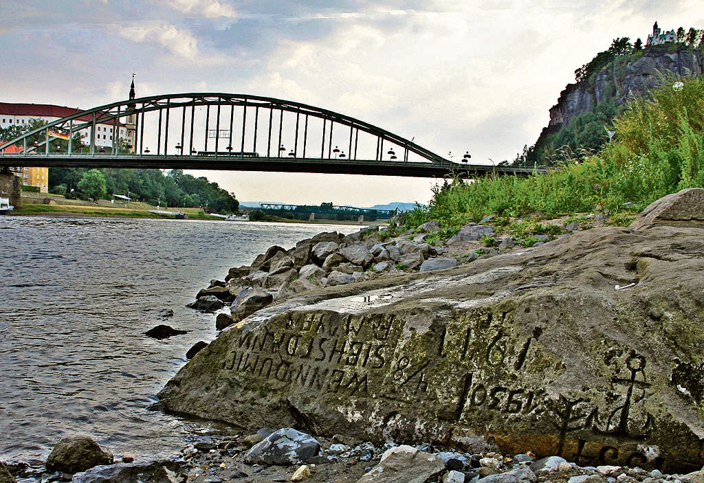 Hunger stones, engraved as famine memorials, emerge as river levels drop. (Norbert Kaiser via Wikimedia Commons) Hunger stones, engraved as famine memorials, emerge as river levels drop. (Norbert Kaiser via Wikimedia Commons)