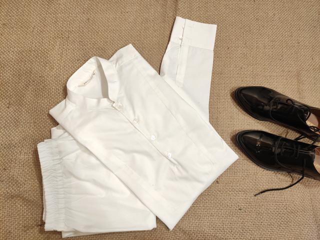 A crisp kurta with fitted lowers looks sophisticated for an Indian look. (White pleated poplin kurta with a mandarin collar and straight pyjamas by Abhishti) A crisp kurta with fitted lowers looks sophisticated for an Indian look. (White pleated poplin kurta with a mandarin collar and straight pyjamas by Abhishti)