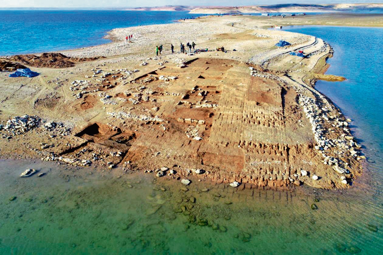 Ruins of walls, warehouses and a palace have been uncovered on the bed of the Mosul reservoir. They are thought to be part of the ancient city of Zakhiku, which stood here 3,500 years ago. (Universities of Freiburg and Tübingen, KAO) Ruins of walls, warehouses and a palace have been uncovered on the bed of the Mosul reservoir. They are thought to be part of the ancient city of Zakhiku, which stood here 3,500 years ago. (Universities of Freiburg and Tübingen, KAO)