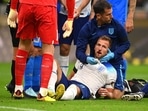 The medics treat Harry Kane during England's 1-0 defeat vs Italy at San Siro.