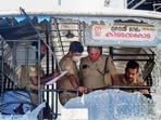 Police personnel take stock of the damages done to a Kerala State Road Transport Corporation bus after some miscreants threw stones on it, Police personnel take stock of the damages done to a Kerala State Road Transport Corporation bus after some miscreants threw stones on it, 