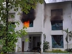 Smoke billows from a factory owned by Pulkit Arya after locals set it on fire, in Pauri Garhwal district.(PTI)