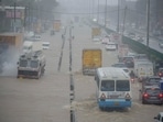Vehicles pass through heavily flooded Gurugram road. (Photo by Parveen Kumar/Hindustan Times)