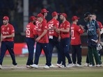 Pakistan Shan Masood, right, shakes hand with England's player on the end of the third twenty20 cricket match between Pakistan and England, in Karachi, Pakistan, Friday, Sept. 23, 2022. (AP Photo/Anjum Naveed