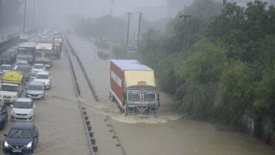 Gurugram, India-September 24: Vehicles wade through a waterlogged stretch in heavy rain on the NH-48 service road near Narsinghpur village, in Gurugram, India, on Saturday, September 24, 2022. (Photo by Parveen Kumar/Hindustan Times) Gurugram, India-September 24: Vehicles wade through a waterlogged stretch in heavy rain on the NH-48 service road near Narsinghpur village, in Gurugram, India, on Saturday, September 24, 2022. (Photo by Parveen Kumar/Hindustan Times)