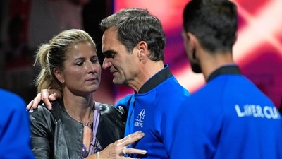 An emotional Roger Federer is embraced by his wife Mirka (AP) An emotional Roger Federer is embraced by his wife Mirka (AP)