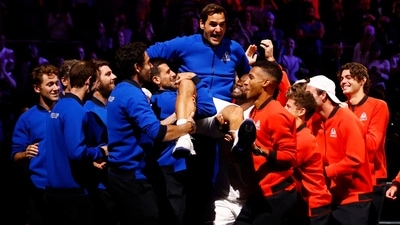 Team Europe and World members lift Roger Federer at the end of his match (REUTERS)