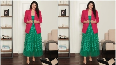 Anshula's strapless maxi dress comes in a teal green hue. It features a plunging neckline, circular cut-outs throughout the ensemble, a see-through overlay, pleated sheer tulle additions on the trims, and an ankle-length hemline.&nbsp; (Instagram)