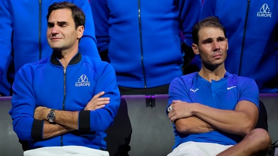 An emotional Roger Federer sits alongside Rafael Nadal after their Laver Cup doubles match(AP)