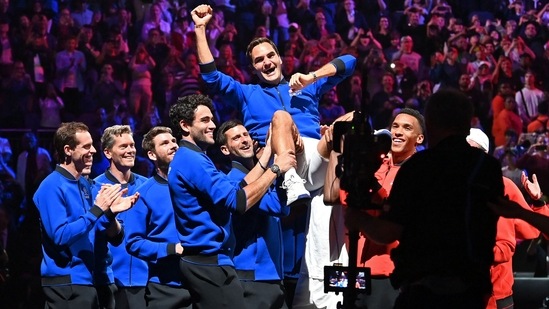 Roger Federer is given the bumps by teammates after playing his final match at Laver Cup(AFP)