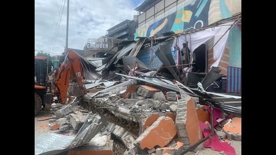 The civic body conducted an anti-encroachment drive on Friday and pulled down unauthorised structures at Balewadi high street and cleared 20,000 square foot of encroachment (HT PHOTO)