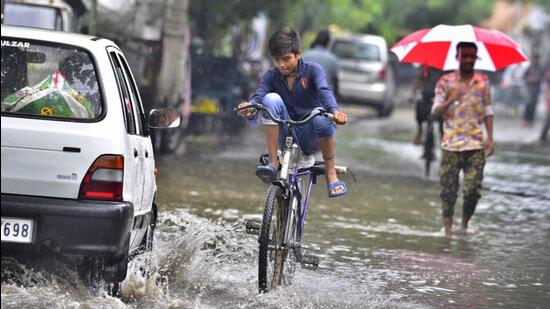 The 43mm rain witnessed over the course of Saturday left most major Ludhiana roads flooded. (Gurpreet Singh/HT)