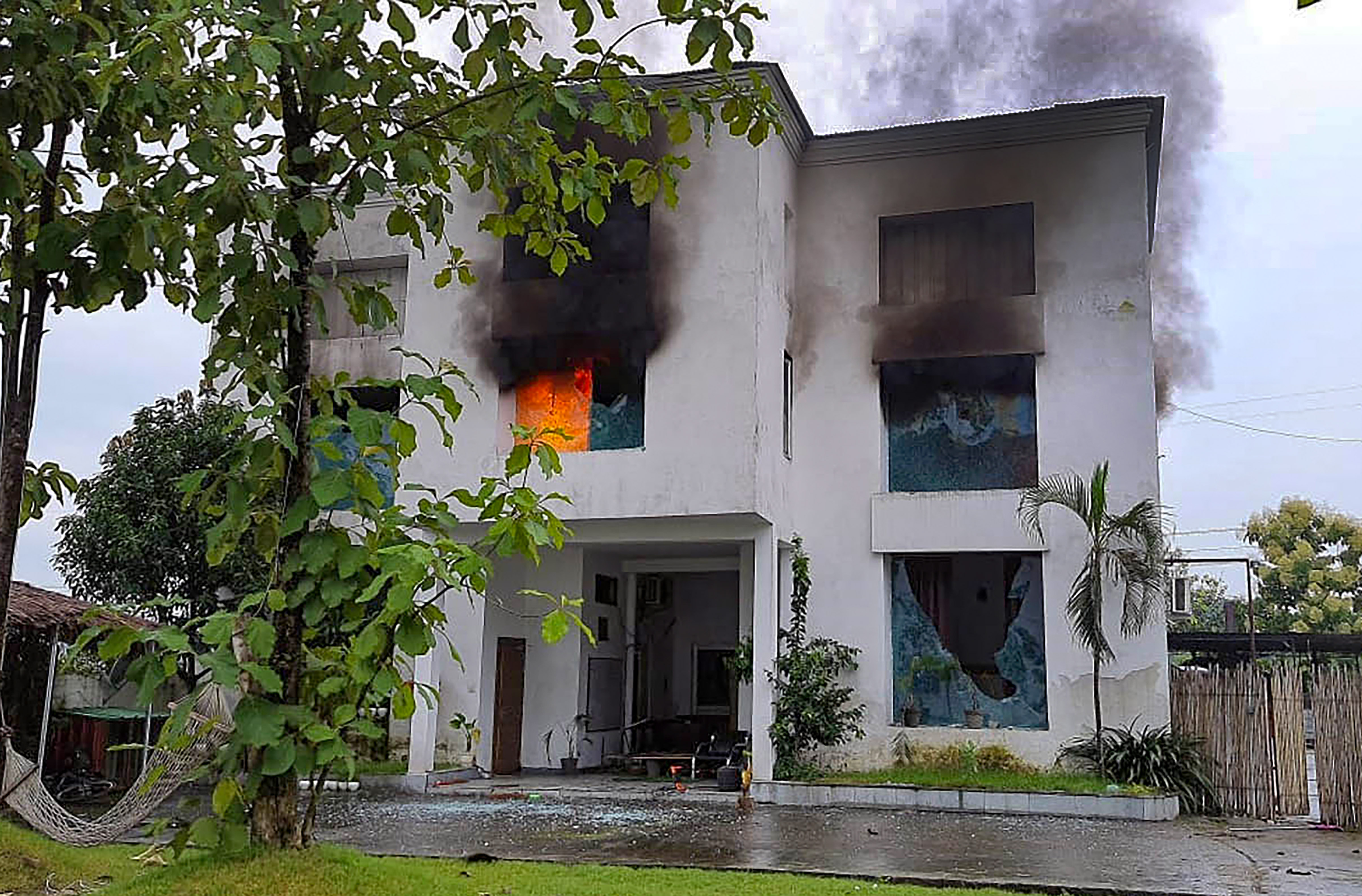 Smoke billows from a factory owned by Pulkit Arya after locals set it on fire, in Pauri Garhwal district. (PTI) Smoke billows from a factory owned by Pulkit Arya after locals set it on fire, in Pauri Garhwal district. (PTI)