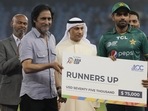 Pakistan's captain Babar Azam receives the runners up award from Chairman Pakistan Cricket Board Ramiz Raja during the presentation ceremony.(AP) Pakistan's captain Babar Azam receives the runners up award from Chairman Pakistan Cricket Board Ramiz Raja during the presentation ceremony.(AP)
