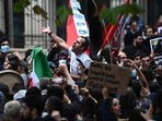Mahsa Amini Protests In France: People take part in a demonstration in support of Iranian protesters in Paris. Mahsa Amini Protests In France: People take part in a demonstration in support of Iranian protesters in Paris.