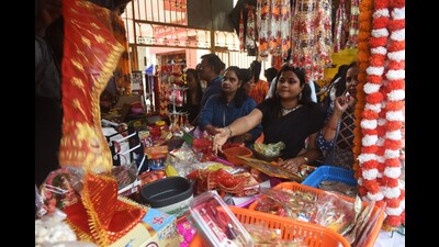 Women buying puja material a day before Navratri, on Sunday. (HT)