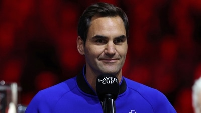 Switzerland's Roger Federer speaks at the presentation ceremony as Team World players celebrate victory over Team Europe in the 2022 Laver Cup