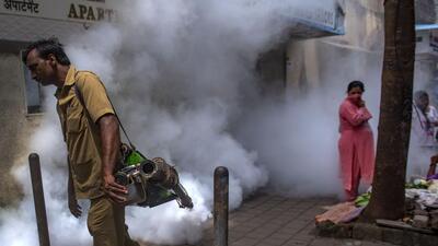 Mumbai, India - August 02, 2022: A BMC worker fumigates the area as a preventive measure against the spread of dengue and malaria diseases during monsoon season, at Byculla, in Mumbai, India, on Tuesday, August 02, 2022. (Photo by Satish Bate/Hindustan Times) (Satish Bate/HT PHOTO) Mumbai, India - August 02, 2022: A BMC worker fumigates the area as a preventive measure against the spread of dengue and malaria diseases during monsoon season, at Byculla, in Mumbai, India, on Tuesday, August 02, 2022. (Photo by Satish Bate/Hindustan Times) (Satish Bate/HT PHOTO)