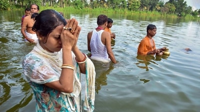 Agartala: Devotees take a holy dip & offer 'Tarpan' on the last day of 'Pitru Paksha', (PTI) Agartala: Devotees take a holy dip & offer 'Tarpan' on the last day of 'Pitru Paksha', (PTI)