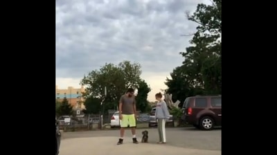 A screengrab from the viral video shows pet parents and their dog.&nbsp; (Twitter/@buitengebieden)