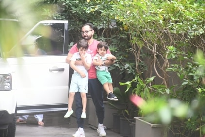 Saif Ali Khan holds Taimur and Jehangir together. (Varinder Chawla)