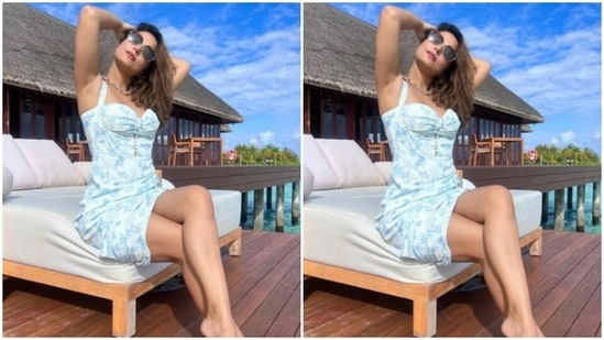 Hina wore her coloured tresses open in beach wavy curls with a side part as she posed for the pictures.(Instagram/@realhinakhan)