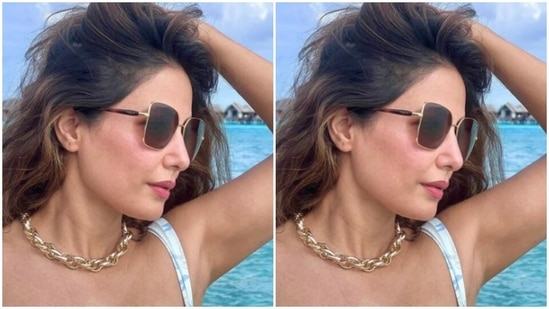 Hina matched her blue backdrop in a white summer dress with patterns in pastel blue all over.(Instagram/@realhinakhan)
