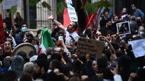 Mahsa Amini Protests In France: People take part in a demonstration in support of Iranian protesters in Paris.(AFP)