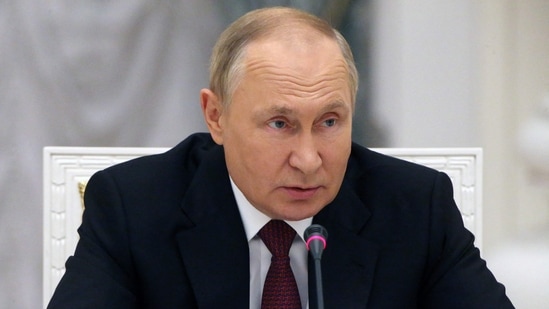 Russian President Vladimir Putin chairs a meeting.(AFP)