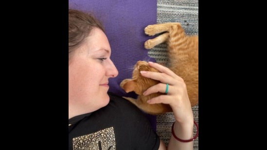 The cat interrupts its human’s yoga session.&nbsp;(Instagram/@invisibleindia)