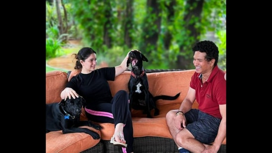 Sachin Tendulkar with daughter Sara and their pet dogs, as seen in his Daughters' Day post.&nbsp;(Instagram/@sachintendulkar)