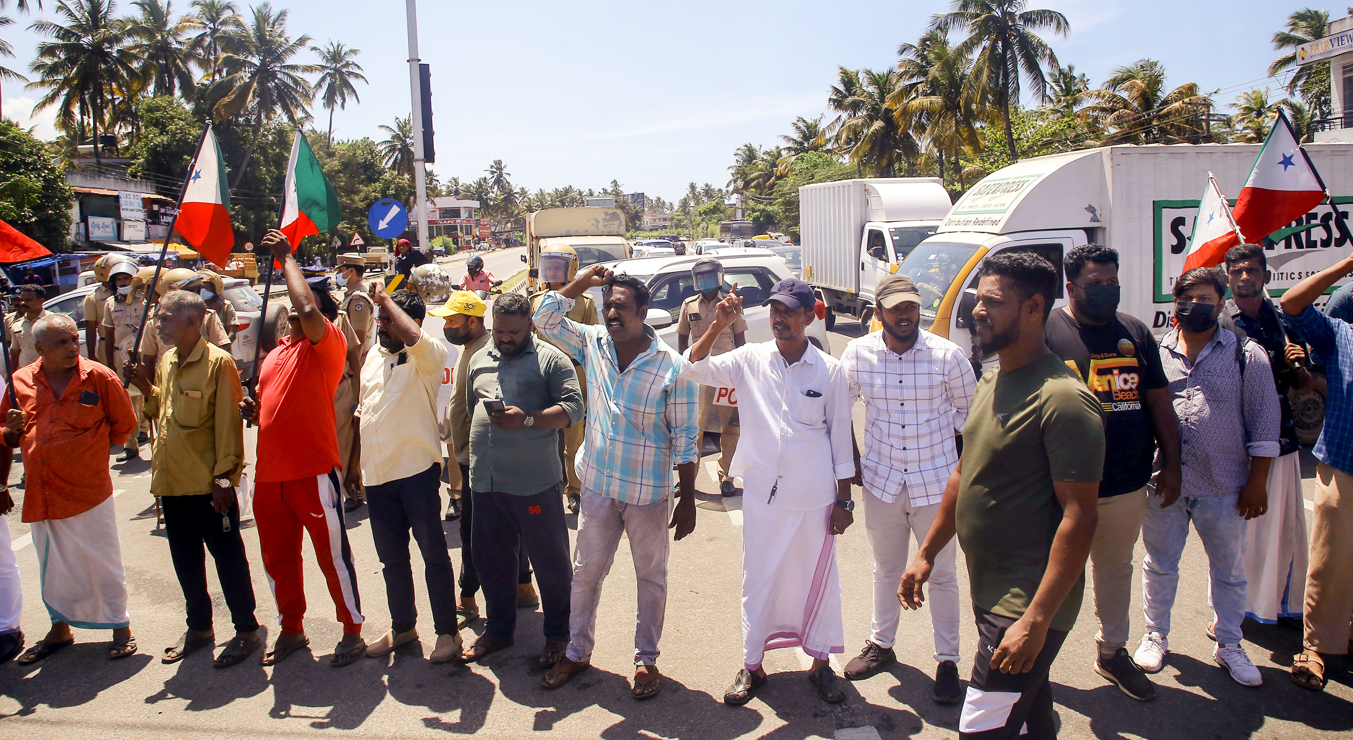 Activists of Popular Front of India (PFI) block Kazhakootam - Kovalam bypass during their protest against the raid by NIA on the PFI party offices in Kerala, in Thiruvananthapuram. (PTI) Activists of Popular Front of India (PFI) block Kazhakootam - Kovalam bypass during their protest against the raid by NIA on the PFI party offices in Kerala, in Thiruvananthapuram. (PTI)