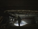 Russia-Ukraine War: A Ukrainian serviceman inspects a kindergarten basement which was used by Russian forces.(AP) Russia-Ukraine War: A Ukrainian serviceman inspects a kindergarten basement which was used by Russian forces.(AP)