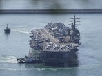 North Korea Missile Test: US aircraft carrier USS Ronald Reagan is escorted into Busan Naval Base in Busan, South Korea.(AP) North Korea Missile Test: US aircraft carrier USS Ronald Reagan is escorted into Busan Naval Base in Busan, South Korea.(AP)