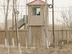 China's Xinjiang: A security guard watches from a tower around a detention facility in Yarkent County in northwestern China's Xinjiang.(AP) China's Xinjiang: A security guard watches from a tower around a detention facility in Yarkent County in northwestern China's Xinjiang.(AP)