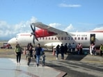 Passengers alighting from the Alliance Air flight at Jubbarhatti airport, 24km from Shimla, after flights resumed on Monday. (Deepak Sansta/HT) Passengers alighting from the Alliance Air flight at Jubbarhatti airport, 24km from Shimla, after flights resumed on Monday. (Deepak Sansta/HT)