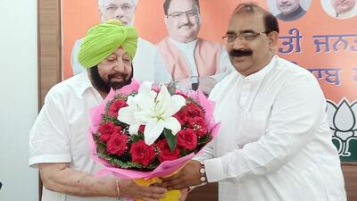 Former chief minister Capt Amarinder Singh being welcomed by Punjab BJP president Ashwani Sharma at the party headquarters in Chandigarh on Monday. (Ravi Kumar/HT)
