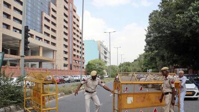 Police personnel barricade a road outside CBI headquarters in Delhi. (ANI) Police personnel barricade a road outside CBI headquarters in Delhi. (ANI)