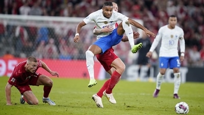 Denmark's Simon Kjaer, center back, lifts France's Christopher Nkunku, during the UEFA Nations League match between Denmark and France at Parken Stadium (AP) Denmark's Simon Kjaer, center back, lifts France's Christopher Nkunku, during the UEFA Nations League match between Denmark and France at Parken Stadium (AP)