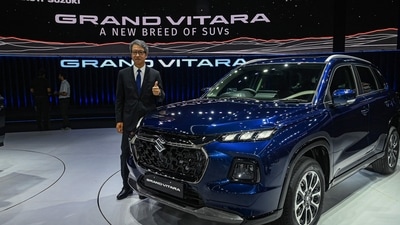 The managing director and chief executive officer of Maruti Suzuki India Limited (MSIL) Hisashi Takeuchi poses with the new SUV Grand Vitara during its global unveiling ceremony in Gurgaon on July 20, 2022. (Photo by Prakash SINGH / AFP) The managing director and chief executive officer of Maruti Suzuki India Limited (MSIL) Hisashi Takeuchi poses with the new SUV Grand Vitara during its global unveiling ceremony in Gurgaon on July 20, 2022. (Photo by Prakash SINGH / AFP)
