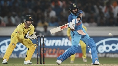 Virat Kohli, right, plays a shot during the third T20 cricket match between India and Australia (AP) Virat Kohli, right, plays a shot during the third T20 cricket match between India and Australia (AP)
