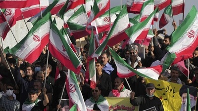 Iran Anti-Hijab Protests: Demonstrators wave Iranian flags during their rally in Tehran, Iran. (AP) Iran Anti-Hijab Protests: Demonstrators wave Iranian flags during their rally in Tehran, Iran. (AP)