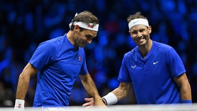 Roger Federer (L) and Rafael Nadal (R) of Team Europe share a joke, playing against USA's Jack Sock and USA's Frances Tiafoe of Team World during their Laver Cup Roger Federer (L) and Rafael Nadal (R) of Team Europe share a joke, playing against USA's Jack Sock and USA's Frances Tiafoe of Team World during their Laver Cup