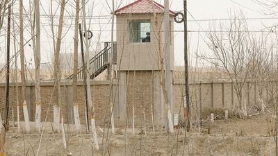 China's Xinjiang: A security guard watches from a tower around a detention facility in Yarkent County in northwestern China's Xinjiang. (AP) China's Xinjiang: A security guard watches from a tower around a detention facility in Yarkent County in northwestern China's Xinjiang. (AP)