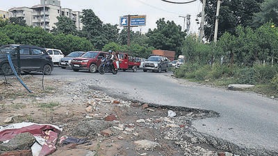 Potholes and bad roads in sector 63 after the rain in Gurugram. (Vipin Kumar/HT Photo) Potholes and bad roads in sector 63 after the rain in Gurugram. (Vipin Kumar/HT Photo)