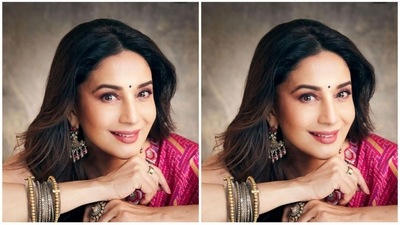 Madhuri Dixit's dewy makeup is the ideal inspiration for you if your vibe is simple and you if don't want to experiment much. Berry pink lips with blushy cheeks, pink eye shadow, mascara and black eyeliner is easy to do and looks beautiful. A little bindi that matches your outfit would be the ideal finishing touch for your appearance. (Instagram/@madhuridixitnene) Madhuri Dixit's dewy makeup is the ideal inspiration for you if your vibe is simple and you if don't want to experiment much. Berry pink lips with blushy cheeks, pink eye shadow, mascara and black eyeliner is easy to do and looks beautiful. A little bindi that matches your outfit would be the ideal finishing touch for your appearance. (Instagram/@madhuridixitnene)