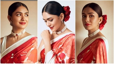 Red is the colour of the festive season and nothing can beat a charm of a good red lipstick. Give your Navratri attire a vintage vibe and chic look by pairing it will a pearl choker, ruby stone embellishments - matching earrings and a low bun with roses. For make go with a black-winged eyeliner, rose-hued glossy lip shade, mascara-adorned lashes, subtle eye shadow, beaming highlighter, blushed cheeks and sharp contouring for the glam picks. And you are ready to rock the Garba nights. (Instagram/@mrunalthakur) Red is the colour of the festive season and nothing can beat a charm of a good red lipstick. Give your Navratri attire a vintage vibe and chic look by pairing it will a pearl choker, ruby stone embellishments - matching earrings and a low bun with roses. For make go with a black-winged eyeliner, rose-hued glossy lip shade, mascara-adorned lashes, subtle eye shadow, beaming highlighter, blushed cheeks and sharp contouring for the glam picks. And you are ready to rock the Garba nights. (Instagram/@mrunalthakur)