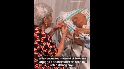 The image, taken from the viral video, shows wife singing to her 70-year-old husband.&nbsp; (Instagram/@goodnews_movement)