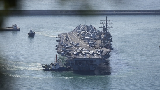 North Korea Missile Test: US aircraft carrier USS Ronald Reagan is escorted into Busan Naval Base in Busan, South Korea.(AP) North Korea Missile Test: US aircraft carrier USS Ronald Reagan is escorted into Busan Naval Base in Busan, South Korea.(AP)
