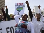 Environmental activists take part in a protest calling for the government to take immediate action against climate change in Cape Town, South Africa, Saturday, September 24.&nbsp;
